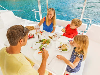 Family eating lunch on yacht