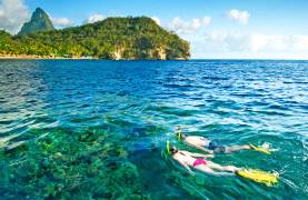 Couple snorkelling in Bluegreen waters of St Lucia
