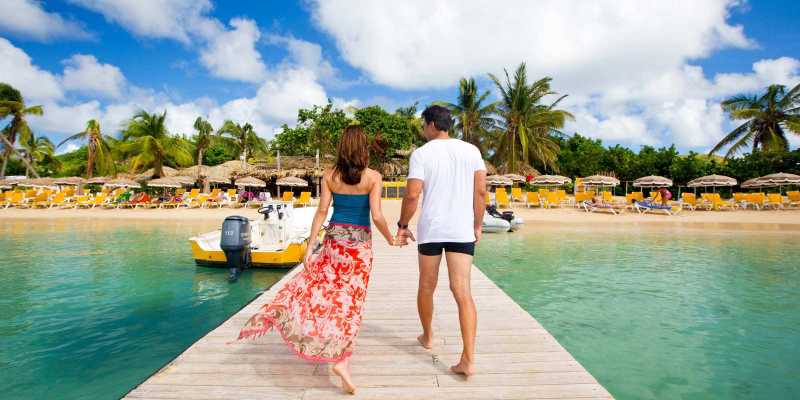 couple walking on pier in St. Martin